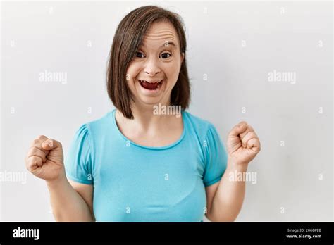 Young Down Syndrome Woman Standing Over Isolated Background Celebrating