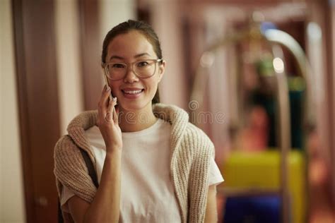 Smiling Asian Woman Arriving At Luxury Hotel Stock Image Image Of