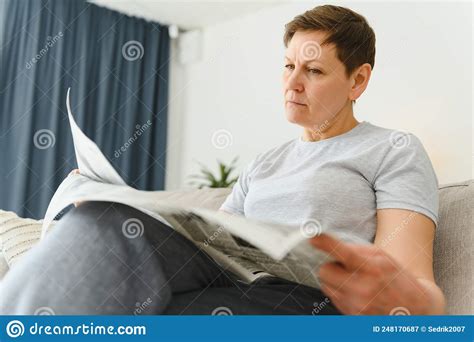 Woman Sitting Reading The Newspaper At Home Stock Image Image Of Mature Enjoying 248170687