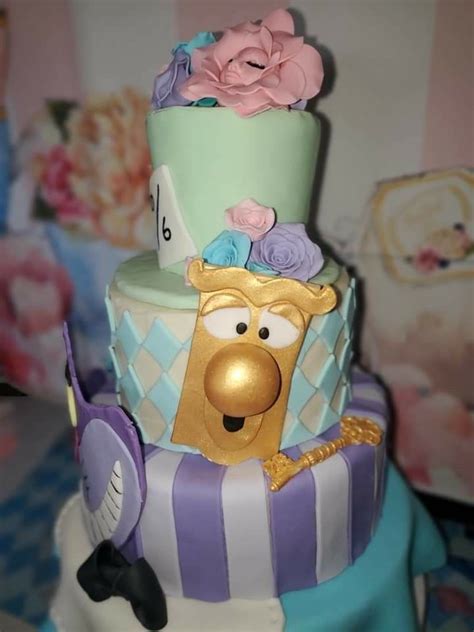 A Three Tiered Cake Decorated With The Characters From Sesame S Movie