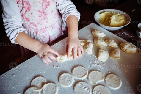 baker girl in chef hat at kitchen 7027999 Stock Photo at Vecteezy