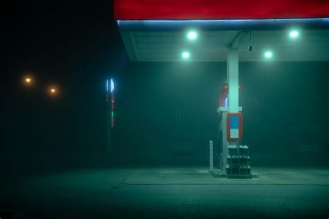 Premium Photo Empty Gas Pump During A Foggy Night With Glowing Lights