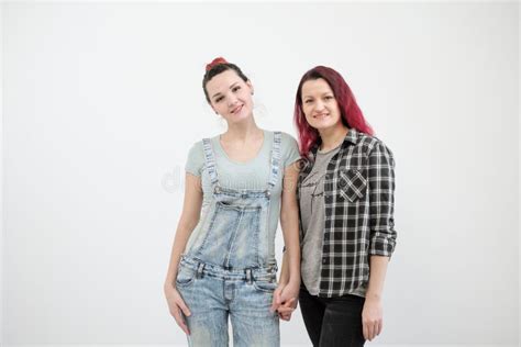 Two Girls Hug On A White Background Homosexual Lesbian Couple Casual