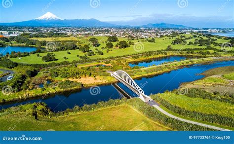 Aerial View On A Beautiful Bridge Across A Small Stream With Mount