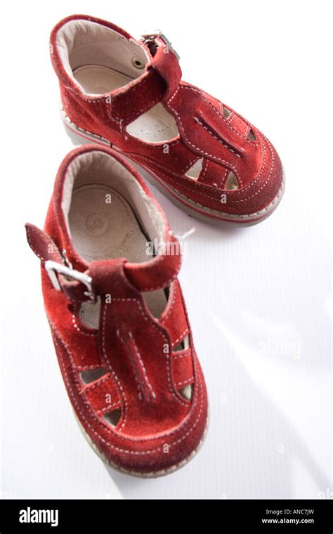 Baby first steps red leather shoes Stock Photo - Alamy