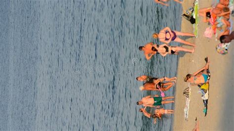 People Relaxing Sandy Beach Seashore Swimming Sea Hot Sunny Summer Day