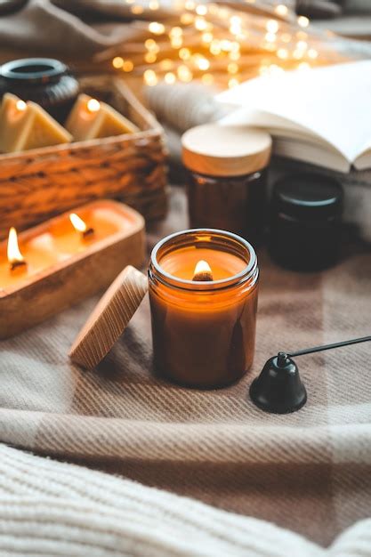 Premium Photo Burning Candle In A Festive Cozy Interior