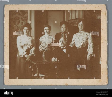 Group Portrait Of Four Unknown Women And A Man In An Interior Stock