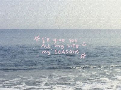 A Message Written In The Sand Next To The Ocean