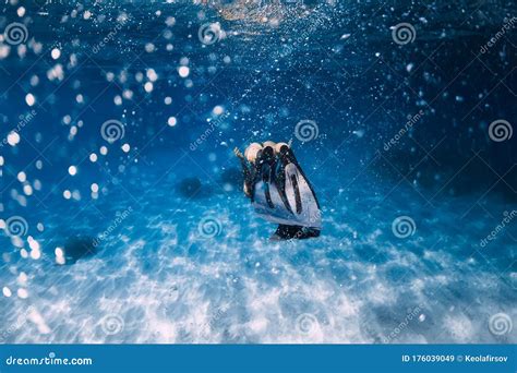 Freediver Glides Over Sandy Sea With White Fins Slim Woman Free Diver