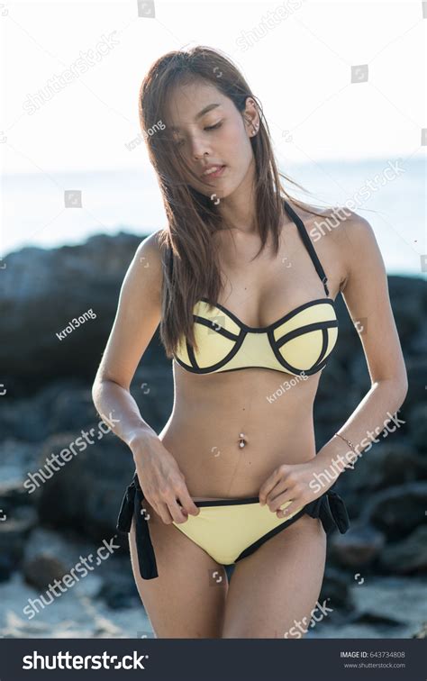 Стоковая фотография 643734808 Sexy Asian Woman Yellow Bikini Two Shutterstock