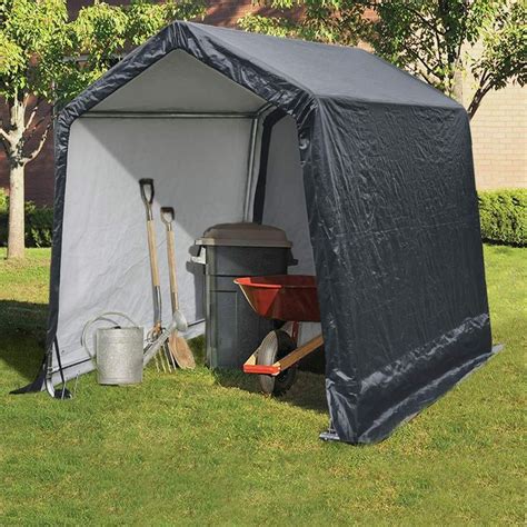 An Outdoor Storage Shed With The Door Open And Gardening Tools In It On