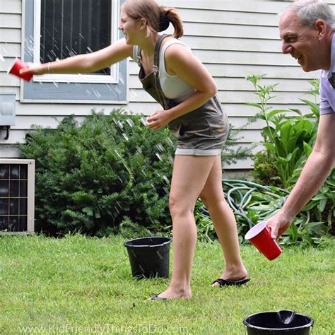 Toss the Water {Hilarious Water Game!} - Kid Friendly Things to Do