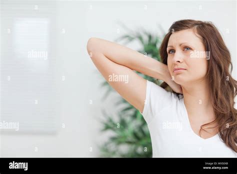 Brunette Touching Her Painful Neck In A Room Stock Photo Alamy
