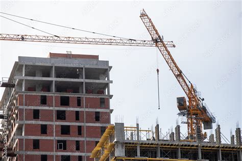 Preparing To Pour A Bucket Of Concrete Into Formworktower Crane