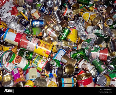 Tin Cans In A Recycling Container Stock Photo Alamy