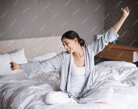 Premium Photo Wake Up Stretch And Happy Woman On A Bed With Morning