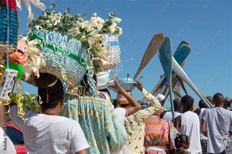 Members of the Candomblé religion carrying baskets of flowers and canoe ...