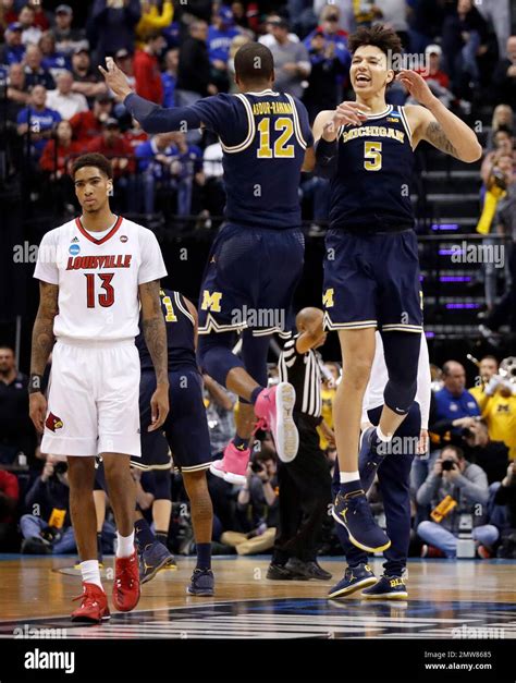 Michigan S D J Wilson And Teammate Muhammad Ali Abdur Rahkman