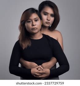 Studio Shot Photo Filipino Lesbian Hugs AI Generated Image 2337729759