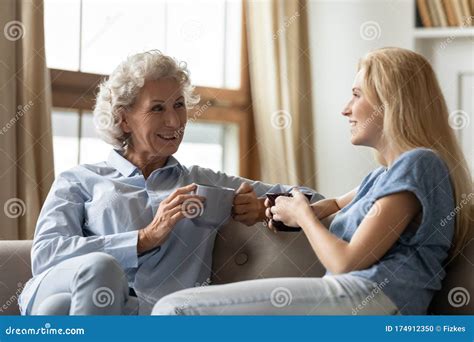 Happy Mature Mother And Adult Daughter Rest At Home Stock Photo Image Of Friend Older