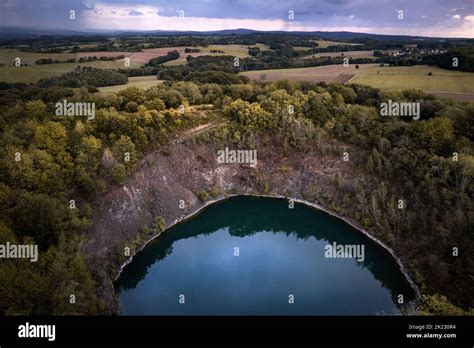 Small Blue Crater Lake Of A Dormant Volcano Surrounded By Forest In