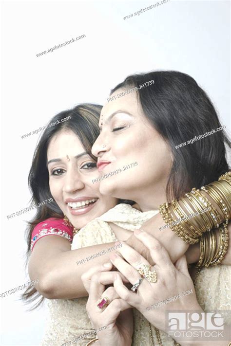 Close Up Of A Mid Adult Woman Hugging A Mature Woman Stock Photo Picture And Royalty Free