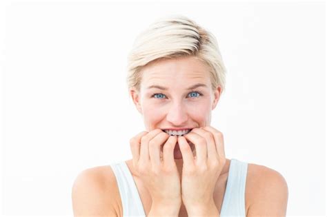 Premium Photo Nervous Woman Biting Her Nails Looking At Camera