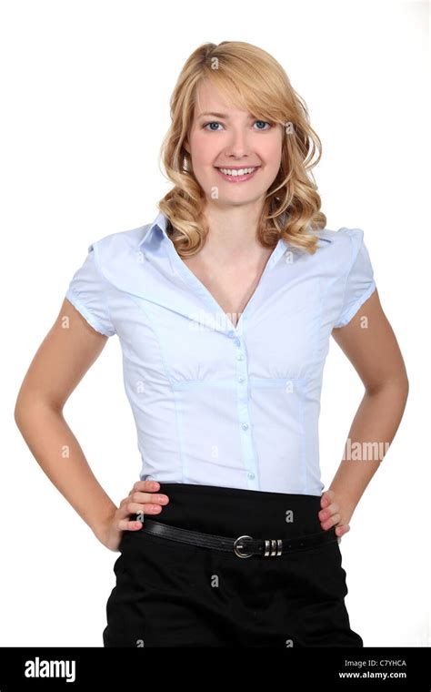 Portrait Of A Woman Standing With Her Hands On Her Hips Stock Photo Alamy