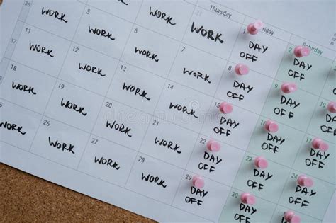 4 Day Work Week Printed Calendar With Pink Pins On Three Days Off In