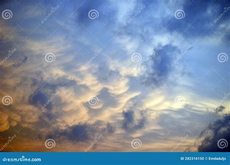 A Gold Sky with the Sun, Clouds Stock Photo - Image of sunset, evening ...