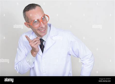 Portrait Of Mature Handsome Man Doctor Against White Background Stock