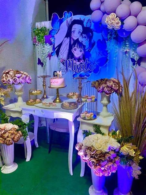 A Table Topped With Lots Of Cake And Flowers