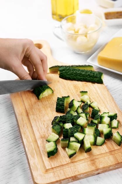 Premium Photo Female Hands Cutting Vegetables For Salad At Kitchen