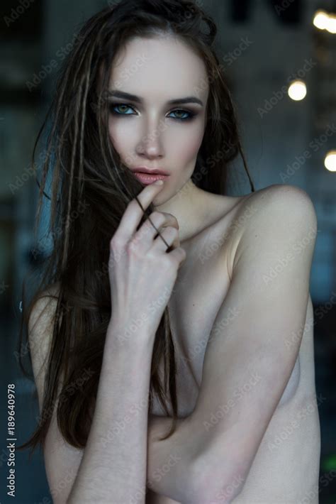 The Beautiful Girl With Naked Shoulders And A Hairstyle From Dreads