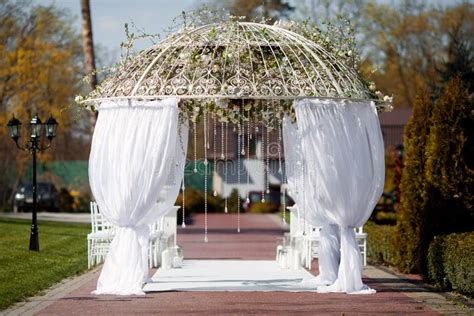 Wedding arch in the garden stock photo. Image of aisle - 53903252