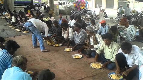 People Giving Food To The Poor