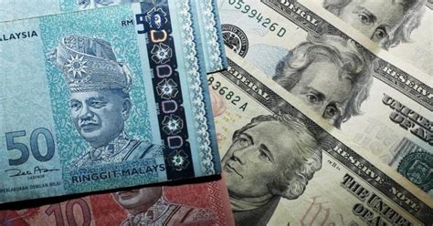 Ringgit Opens Easier Against US Dollar New Straits Times