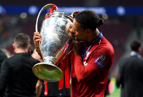 Virgil Van Dijk Holding Champions League Trophy