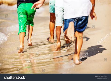 Kids Running Barefoot On Sandy Beach Stock Photo 1240262752 | Shutterstock