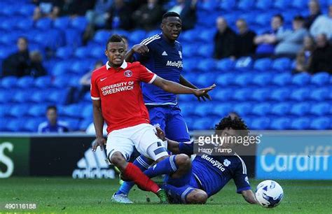 Jordan Cousins of Charlton Athletic is tackled by Fabio of Cardiff ...