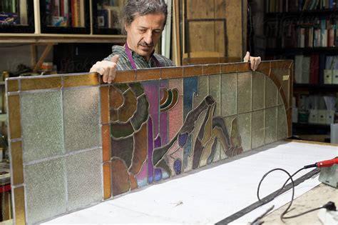 Artisan Holding Stained Glass Panels By Stocksy Contributor Luca Di