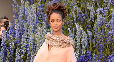 Rihanna Stuns In Over Sized Pink Coat At Dior Pfw Show Fashion Rihanna Travis Scott Just