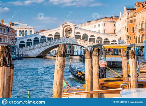 Traditional Gondola Near World Famous Canal Grande And Rialto Bridge