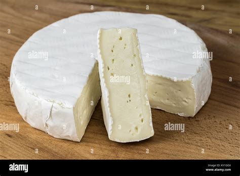 Camembert Cheese Brietriangle Cut Out Placed Vertically Stock Photo