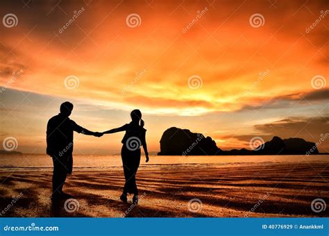 Romantic Couple Holding Hands At Sunset On Beach Stock Image Image Of