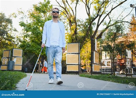 Blind Man Walking On Sidewalk Holding Stick Stock Image Image Of
