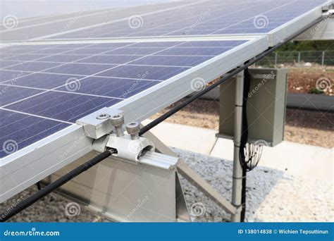 On Ground Solar With Grounding And End Clamps Installation Stock Photo