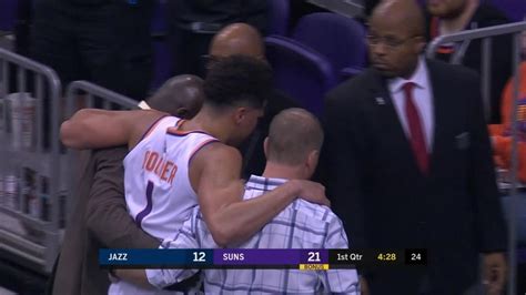 Phoenix Suns' Devin Booker carried off court with strained left ...