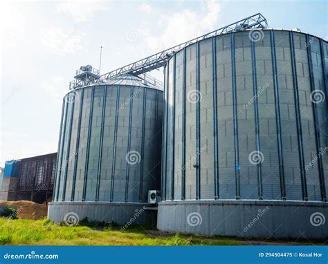 Closeup View Of Paddy Rice Storage Steel Silo In A Milling Plant